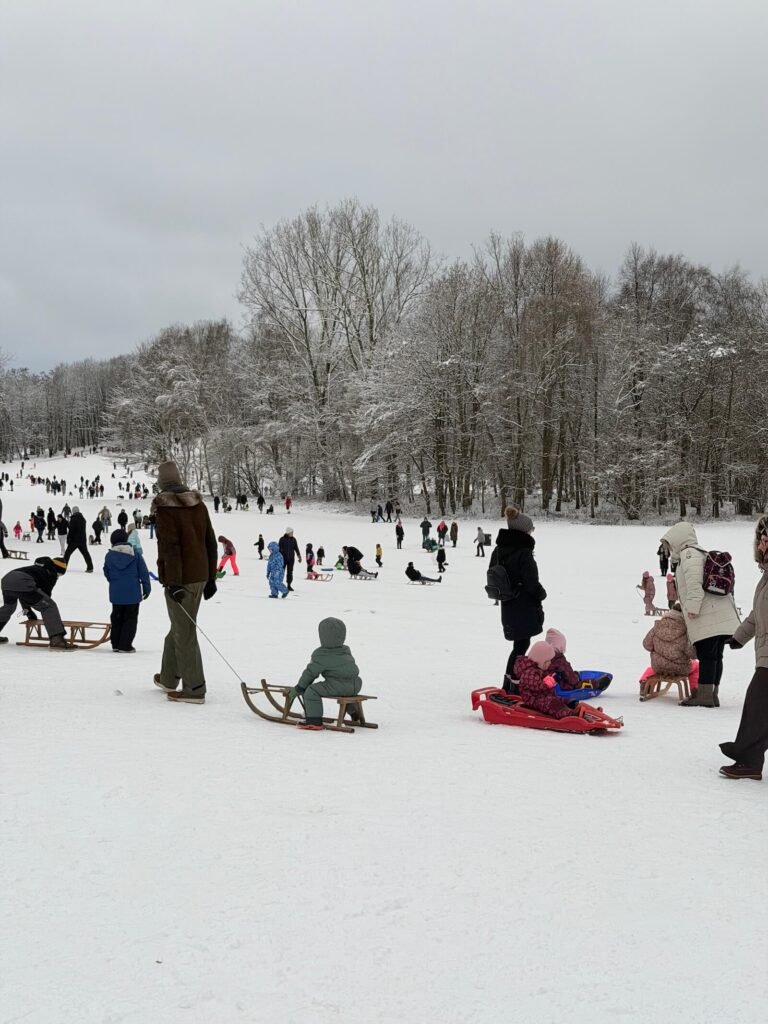 Snowy landscape with children sledding: Extreme Snowstorm Elli Paralyzes Northern Germany